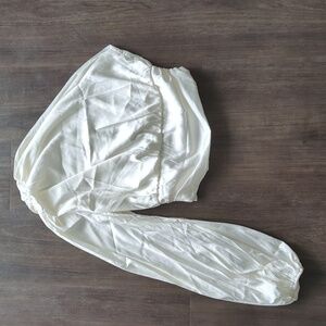 One shoulder white top